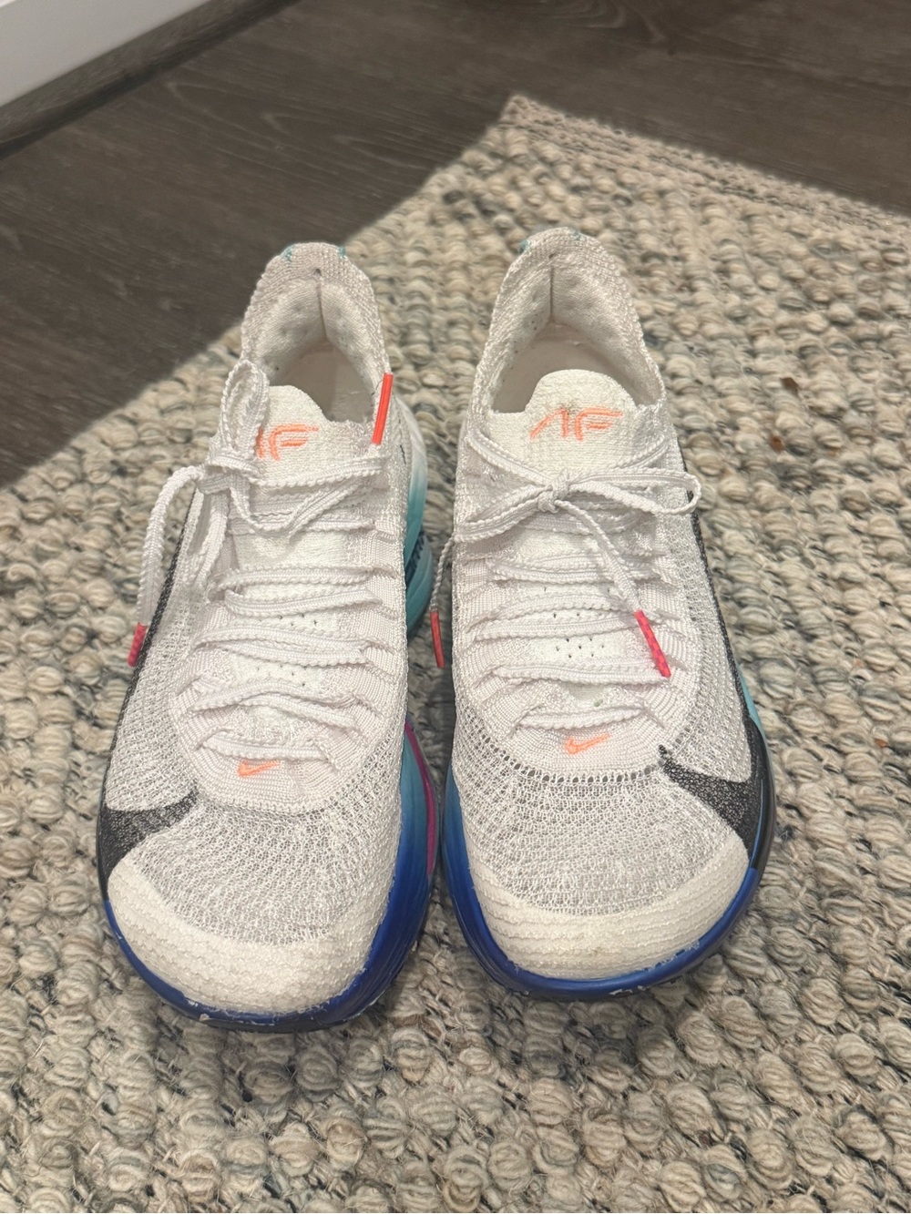 Nike Kids White Knit Sneakers with Blue and Pink Accents